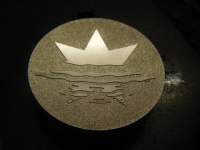 Machining and spark erosion of logo